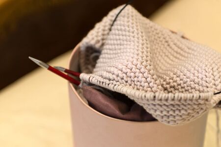 Wool knitting kit and knitting needles, close up