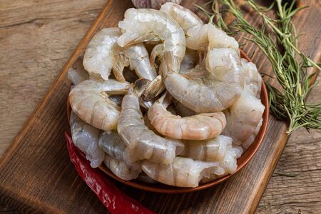 Close up of raw shrimps on wooden backgroundの写真素材