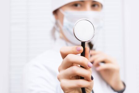 Doctor in a white coat with stethoscope, close upの写真素材