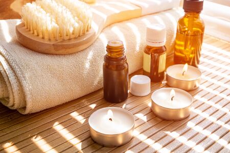 Close-up shot of bathing brush with essential oils and candles. SPA conceptの写真素材
