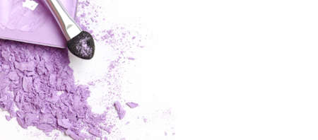 Purple crushed eye shadows and brush isolated on white background. copy spaceの写真素材