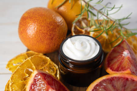 Citrus body cream. Sicilian blood orange essential skincare cream. Facial cream with vitamin C. Fruit facial creamの写真素材