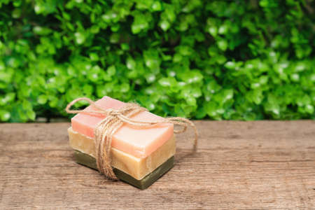 Handmade organic soap on a fresh green leaves nature background. Spa wellness concept. Organic soap spa setの写真素材