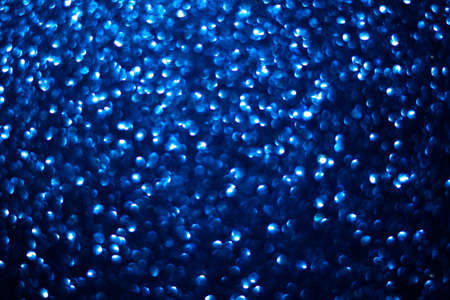 Blue glitter bokeh background. Abstract blue bokeh background. copy spaceの写真素材