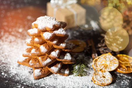 Christmas gingerbread cookies tree, dried sweet fruits decorated with sweet sugar powder. Merry...