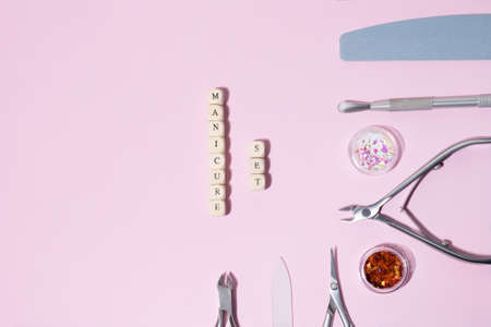 Top view on manicure equipment set. Female nails care equipment set. Manicure and pedicure equipment...