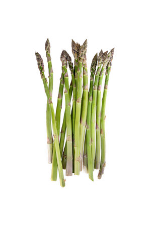 Ripe green asparagus stems isolated on white background. Vegetarian food, bunch of raw asparagus sproutsの写真素材