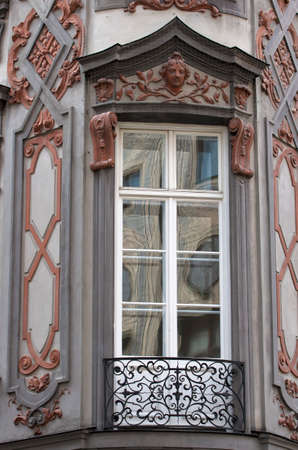 Balcony window.Balcony from cast iron and ornamented facade with relieves.Classical german architecture. Munich,Bavaria,Germanyの写真素材
