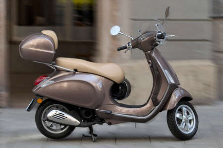 Classic scooter.Small luxury city motorcycle parked on the street.の写真素材