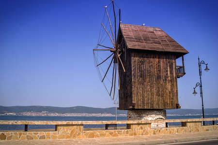 Mill in Nessebar, Black Sea coast, Bulgaria. View of a wooden mill in the old town of Nessebar near sunny beach resort in a sunny dayの写真素材