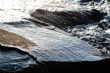 water on the rockの写真素材