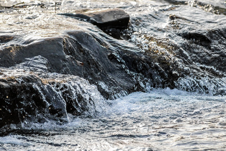 splashing water down the rocks