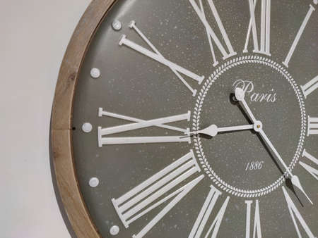 a classical clock hanging on the wall.の写真素材