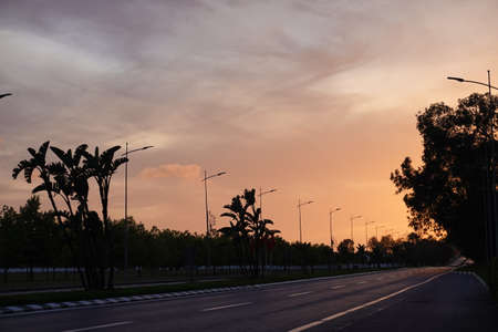 a lonly empty road by the time of sunsetの写真素材