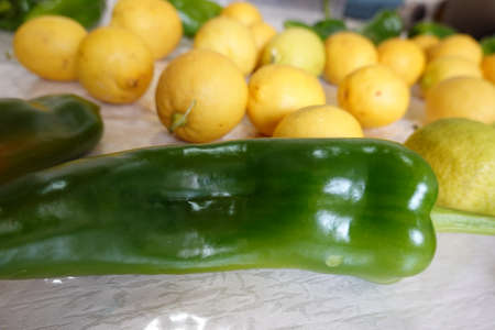 A bowl of oranges on a tableの写真素材