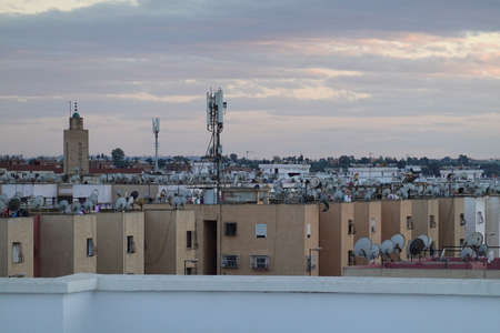 a city scape with buildings a cell towerの写真素材