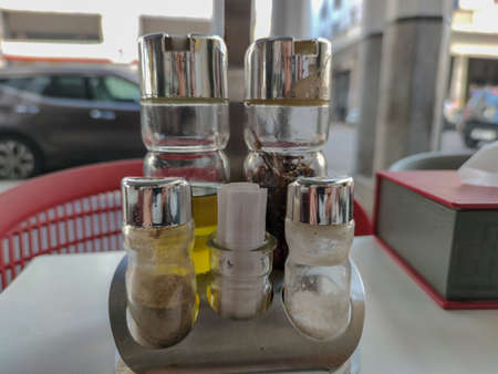 olive oil in a restaurant table in the streetの写真素材