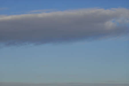 a blue sky full of beautiful cloudsの写真素材