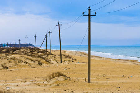 Beach power line is going through sandy beach  Black sea  Anapa region の写真素材