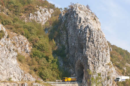 Trucks are going through mountain road tunnel in Montenegro の写真素材