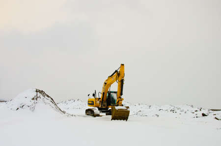 Excavator in Snowの写真素材