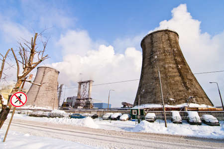 Tubes of the electricity plant and alone tree in Moscowのeditorial素材