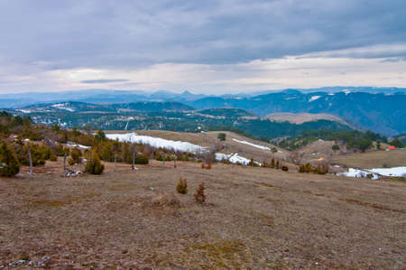 Fields with snow fragments. Landscapes in Zlatibor surroundings. Serbia.の写真素材