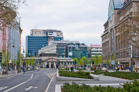 People crowd on the central streest of Berlin, Tauentzienstrasse, with fragment of famous store Ka De We. Berlin, may 2013.のeditorial素材