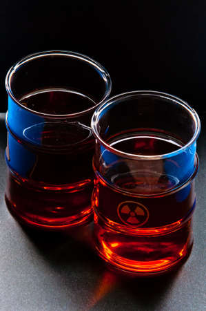 Two transparent glasses and tea with atomic signの写真素材