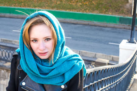 Frozen girl at bidge in the autumn morningの写真素材