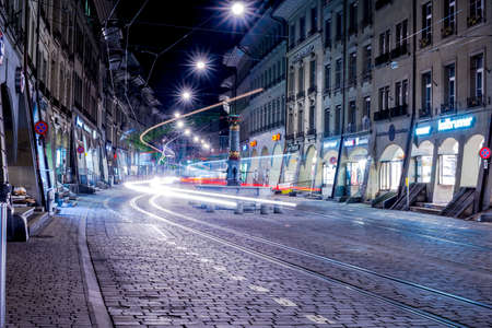 BERN - JAN 22 2014  Marktgasse street with light trails of tram on January 22, 2014, Bern, Switzerland のeditorial素材