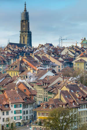 Cathedral view above Bern red roofs in morningの写真素材