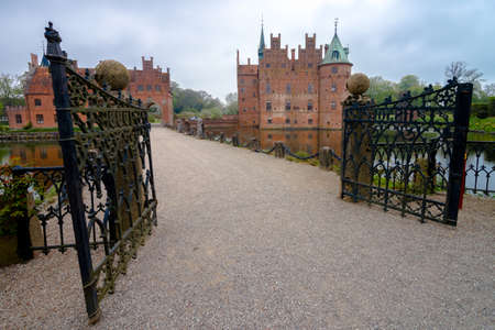 EGESKOV, DEMMARK - 06 May 2014. Egeskov castle general view on cloudy day new on 06 May in Egeskov, Denmark.のeditorial素材