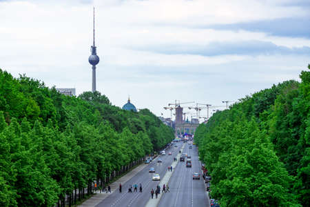 BERLIN - 02 May 2014. Wide, tree lined street in Berlin, Germany, leading to the famous Brandenburg Gate on 01 May 2014 in Berlin.のeditorial素材