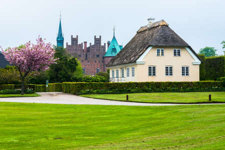 EGESKOV, DEMMARK - 06 May 2014. Egeskov castle general view on cloudy day new on 06 May in Egeskov, Denmark.のeditorial素材