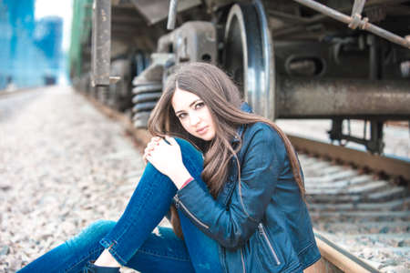 Girl at railroad in Moscow with MIBC in background の写真素材