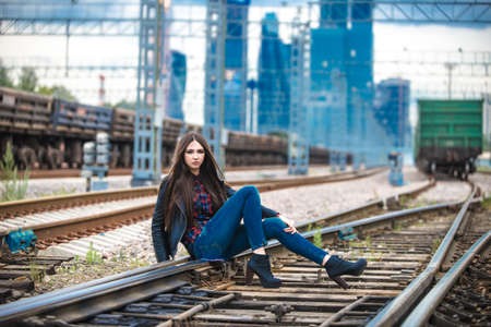 Girl at railroad in Moscow with MIBC in background の写真素材