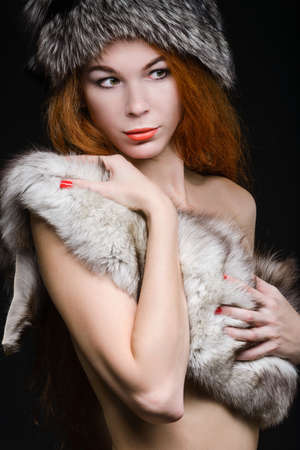 Close up portrait of pretty woman in fursの写真素材