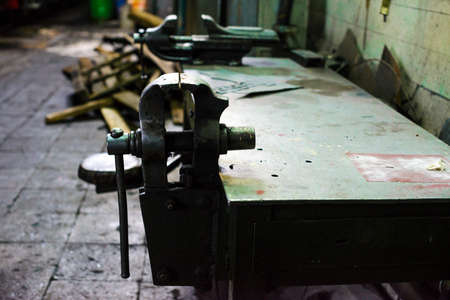 Table with locksmith at old repair plantの写真素材