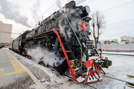 MOSCOW  - 08 January 2015  Old steam locomotive coming to city station Rizhskiy vokzal on 08 January 2015 in Moscowのeditorial素材
