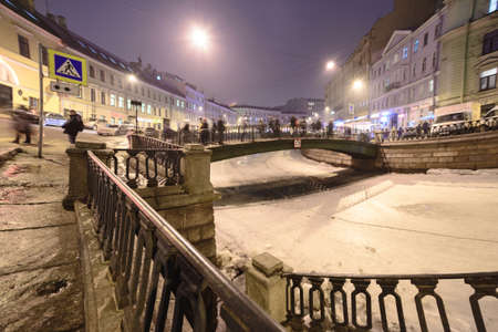 Sankt-Peterburg - FEB 26 2015: Griboedov's embankment and channel with pedestrians on Sennoy bridge of traffic on February 26, 2015, Sankt-Petesburg, Russiaのeditorial素材