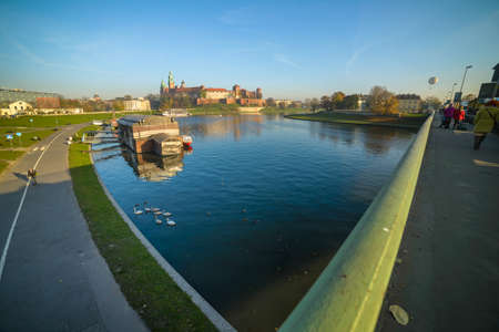 KRAKOW, POLAND - 03 NOVEMBER 2015: Wawel castle with vessels on river on November 03, 2015 in Krakow, Polandのeditorial素材