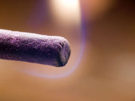 Macroshot of an incense stick just being litの写真素材