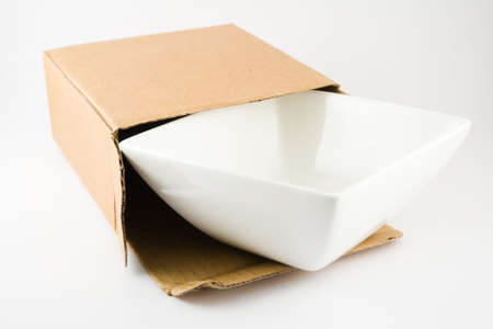 Dish in Cardboard Box isolated on a white backgroundの写真素材