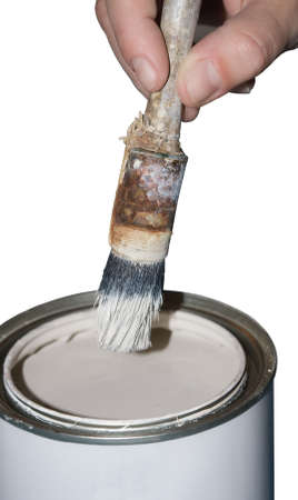 Paint can, brush and hand on a white backgroundの写真素材