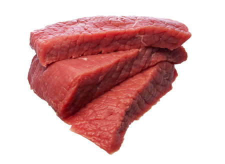 Raw sliced steak isolated over whiteの写真素材