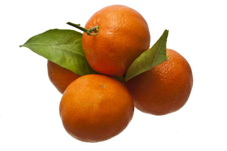 Oranges isolated over white with green leavesの写真素材