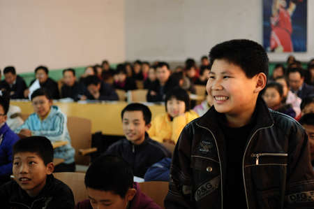 In a classroom lesson, a male student answered confidently questions from teachers. November 10, 2010, Xingtai City, Hebei Province, China.のeditorial素材