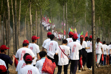 Late spring, the school held a long-distance walking events. Distance of about thirty kilometers. This activity is training the student body, but also to enable students to get close to nature. Xingtai City, Hebei, China, May 27, 2011.のeditorial素材