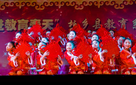 China XingTai City BaiXiang County,December 31, 2014: the school held a wonderful New Year's day party. Unidentified children performed wonderful performances.のeditorial素材